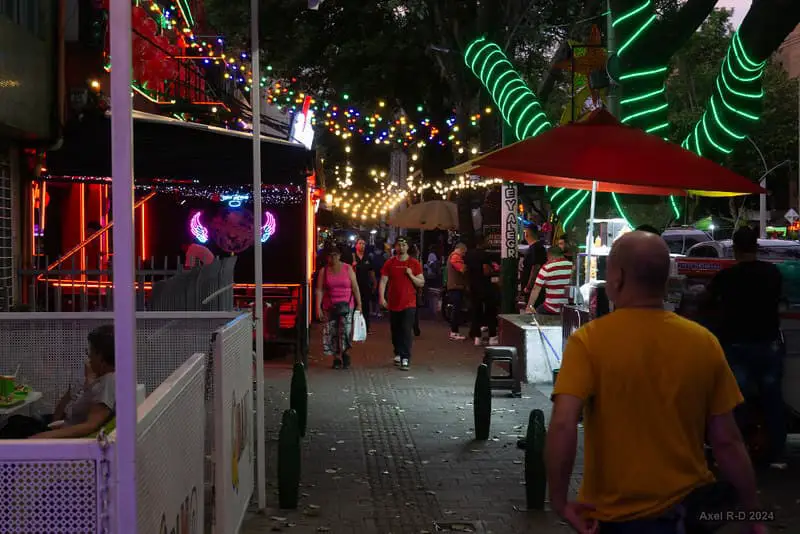 Night street walk in Laureles, Medellin, showcasing its local charm and vibrant atmosphere—an essential part of discovering Where to Stay in Medellin.