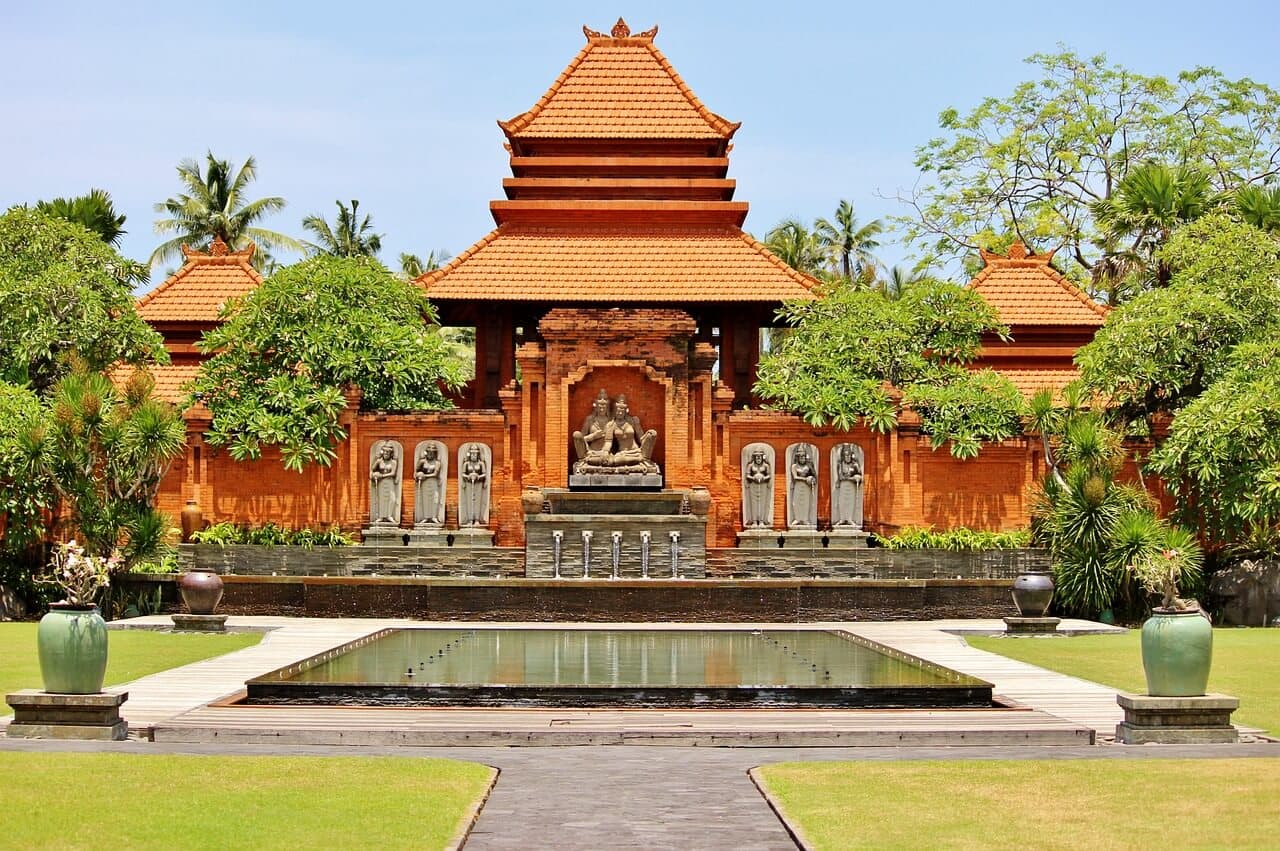 Traditional Balinese temple in Kuta, Bali surrounded by lush greenery