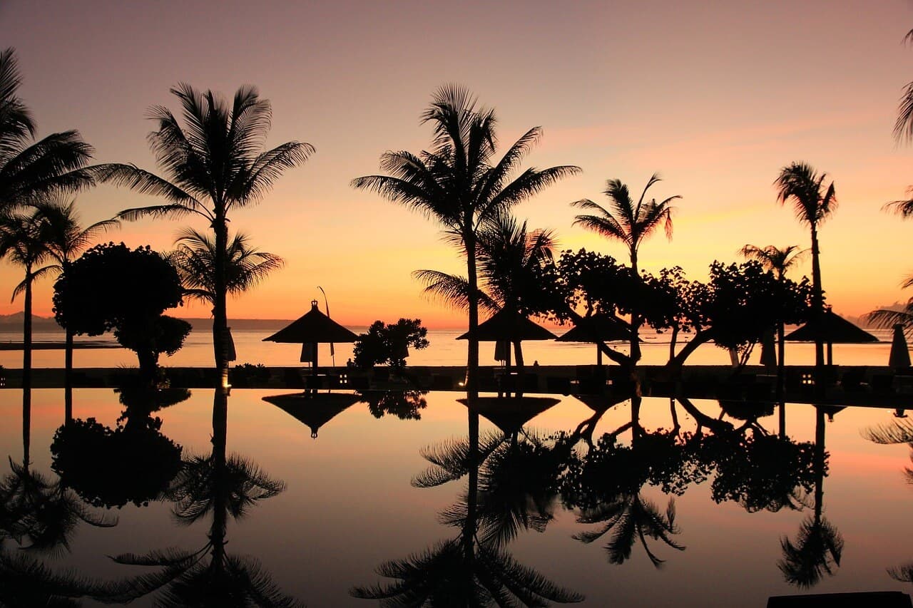 Scenic sunset view in Bali with vibrant skies and ocean horizon.