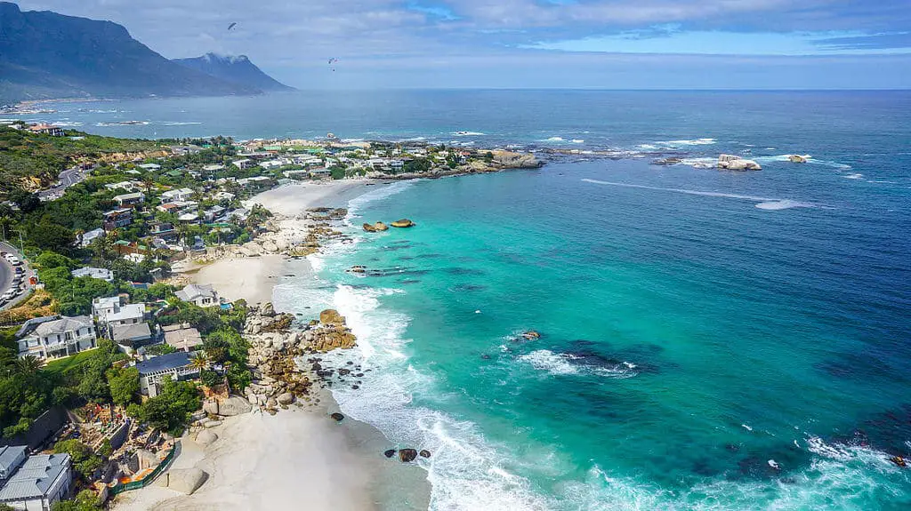 Where to Stay in Cape Town - Scenic view of Clifton Beach with white sand and turquoise waters.