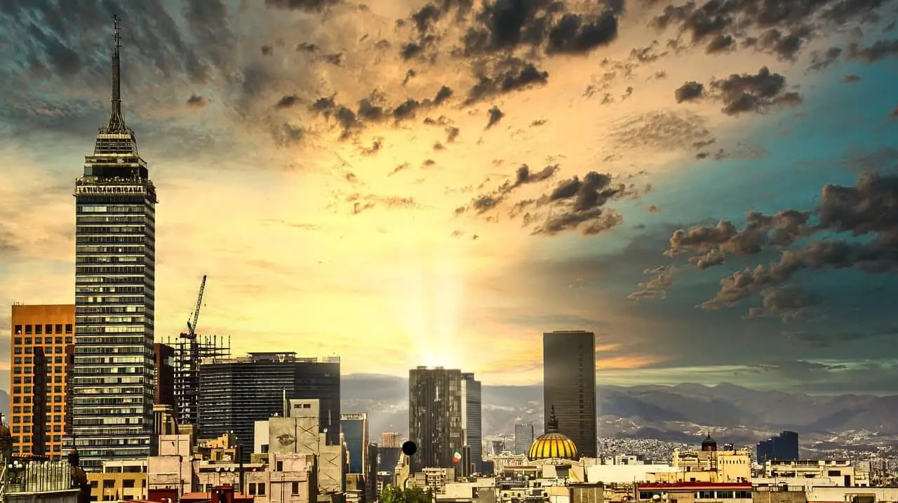 Sunset view of Mexico City highlighting its vibrant skyline and cultural charm - Where to Stay in Mexico City First Time.