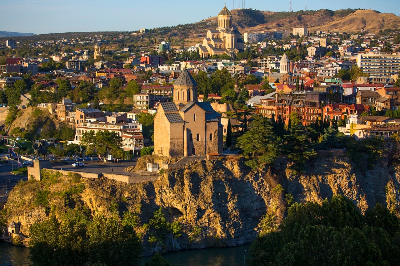 A picturesque view of Tbilisi's Old Town, featuring historic buildings, colorful balconies, and cobblestone streets